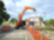 Good photo, mush photo shop digger in back gound has another drainage company name on plea