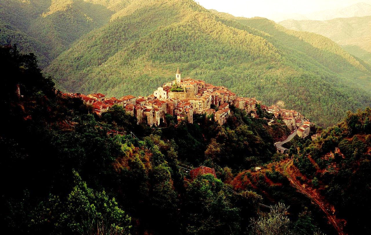 Hillside view of Apricale with mountains and hills