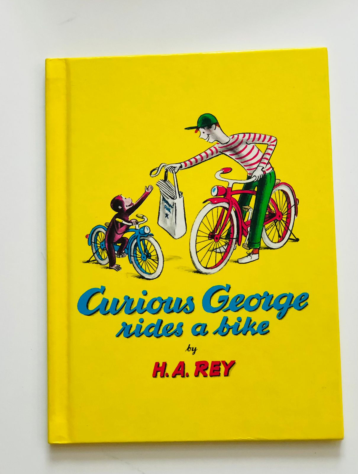 Curious George rides a bike