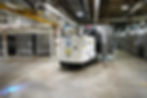 AGV in carring cans in manufacturing facility.jpg