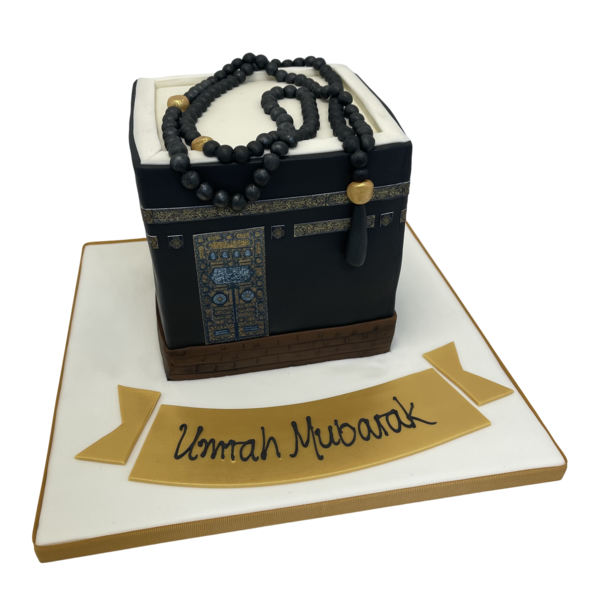 A beautifully designed Kabaa 'Umrah Mubarak' cake with intricate detailing and traditional elements, perfect for celebrating a special occasion.