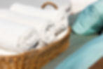 hotel-towels-rolled-wooden-basket.jpg