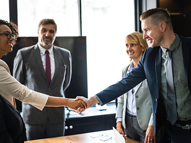 photo of stakeholders shaking hands