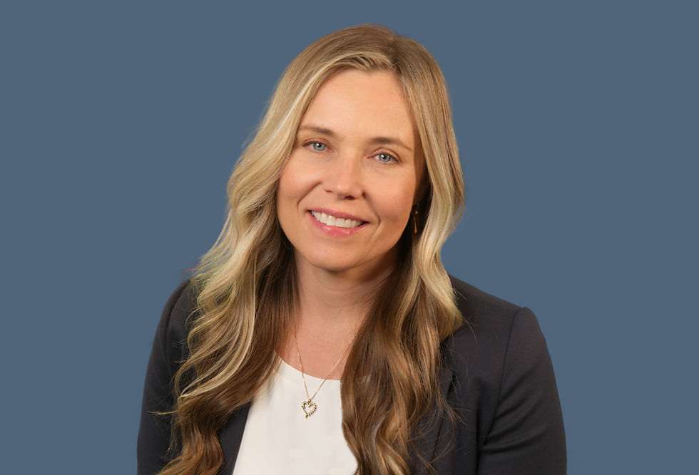 Jill headshot wearing a white shirt and dark blazer
