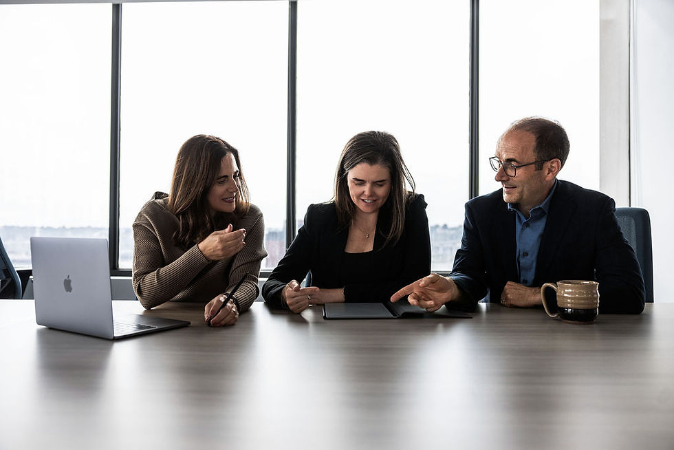 this is a team photo working in a boardroom