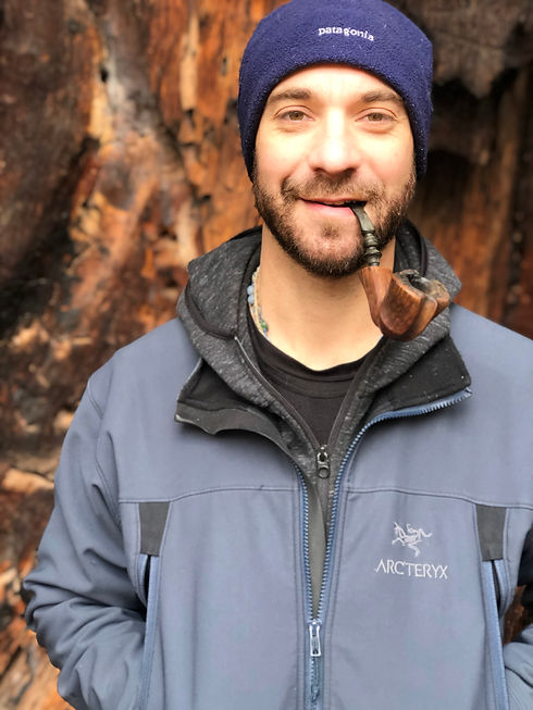 Image of Korim Piko with a pipe