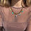 Miniature : Collier doré en acier inoxydable avec des pendentifs ex voto en plaqué or 18k bleus verts turquoises (coeurs sacrés et oeil)