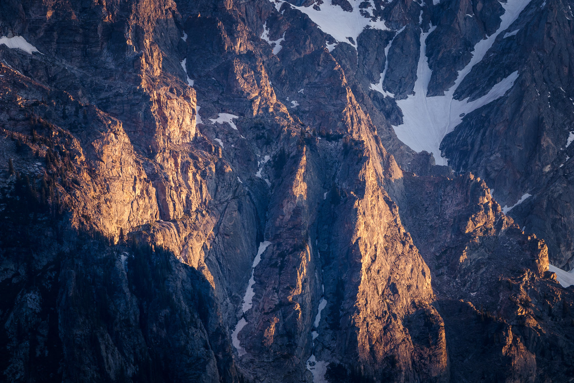 Fine art print of the last light of the day brushing the mountainside in Grand Teton National Park. By Michael Rung