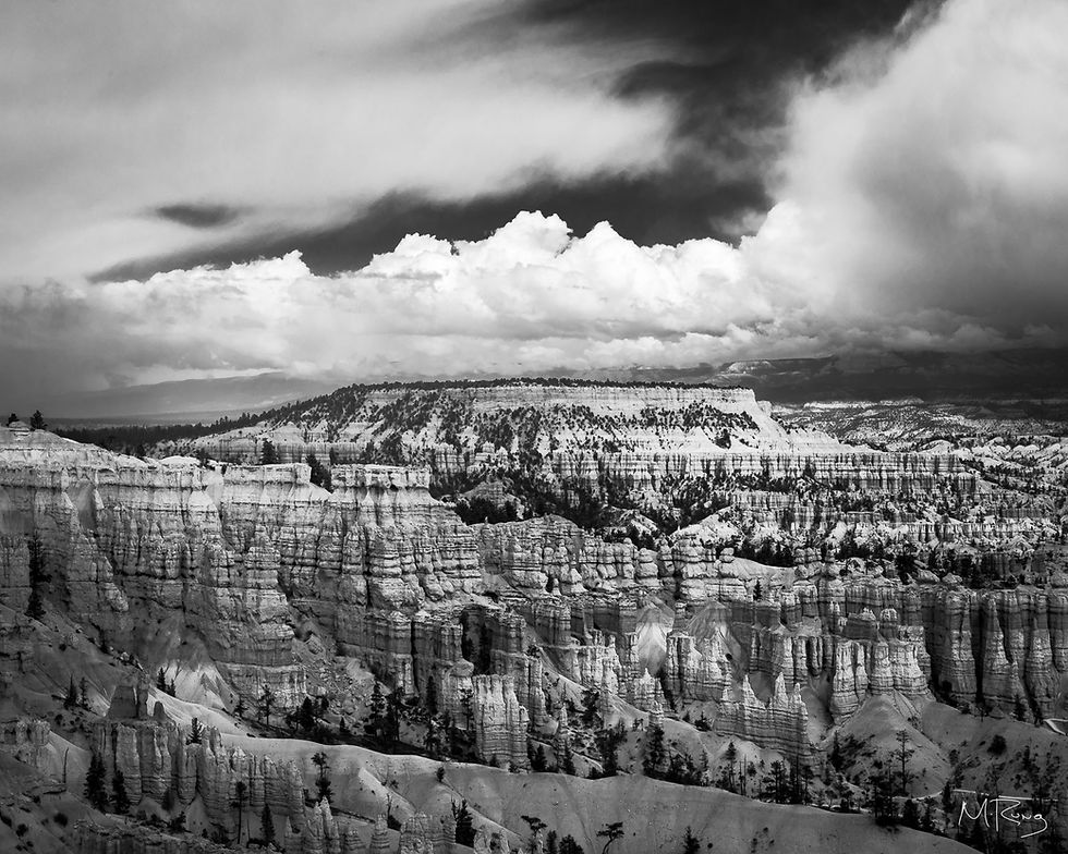 A dramatic black and white photo of a clearing winter storm over Bryce Canyon National Park. Michael Rung Photography