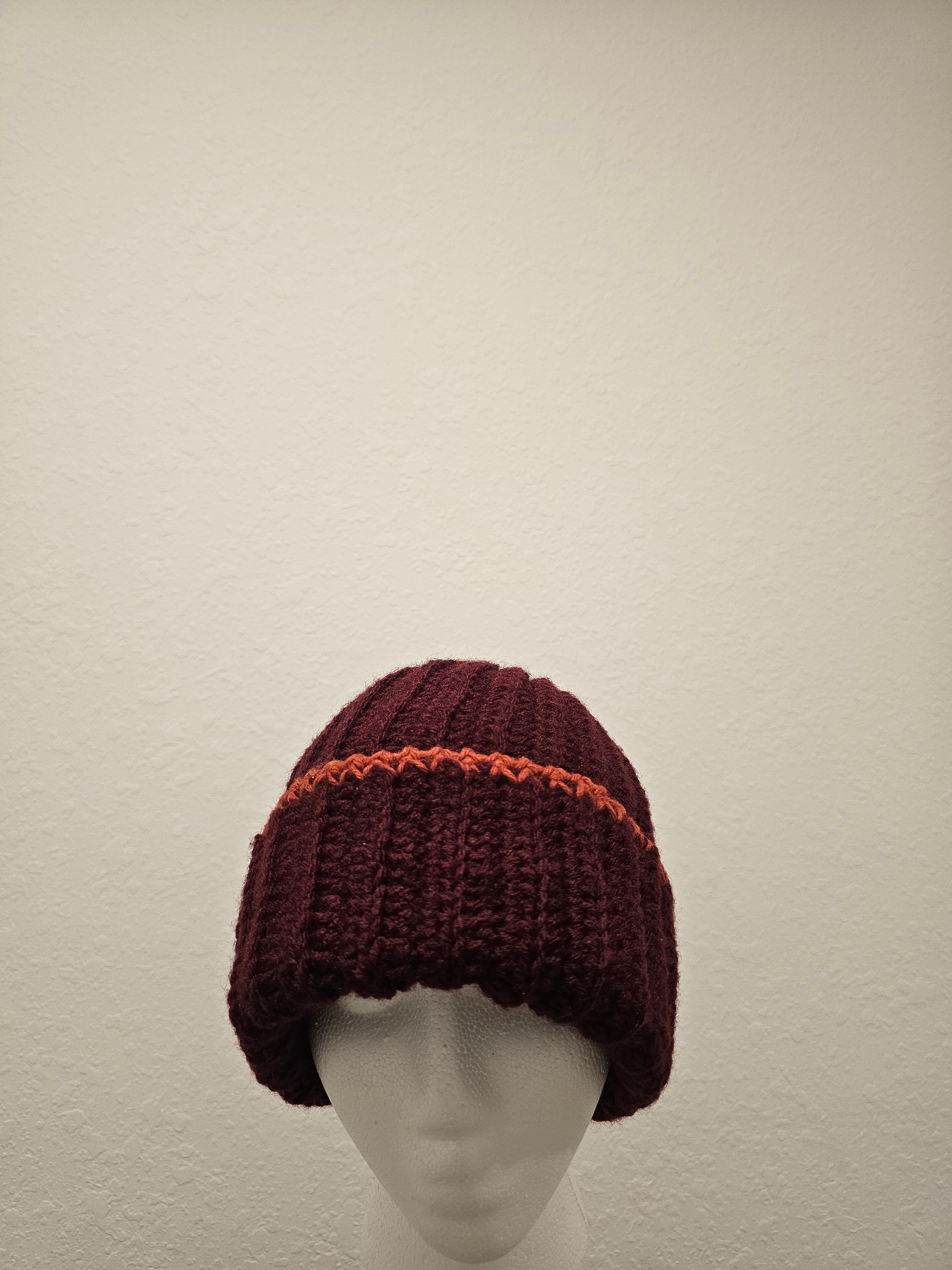 Burgundy hat, one size fit all .