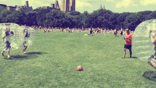 Kids crashing into each other at park.