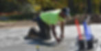 Concrete contractor hand-finishing a freshly poured concrete slab for residential construction