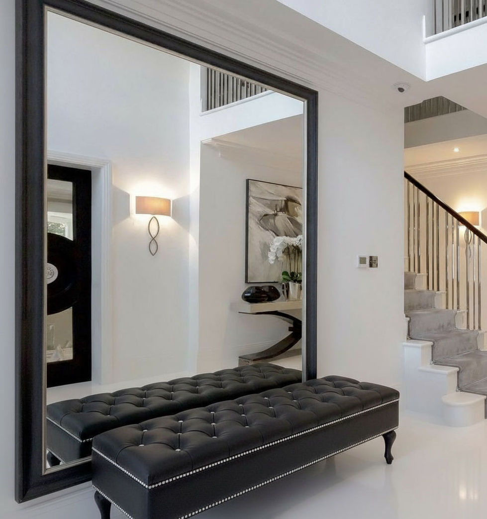 Large mirror over black bench; meble tapicerowane do przedpokoju, ławeczki; modern entryway design; Światpuf