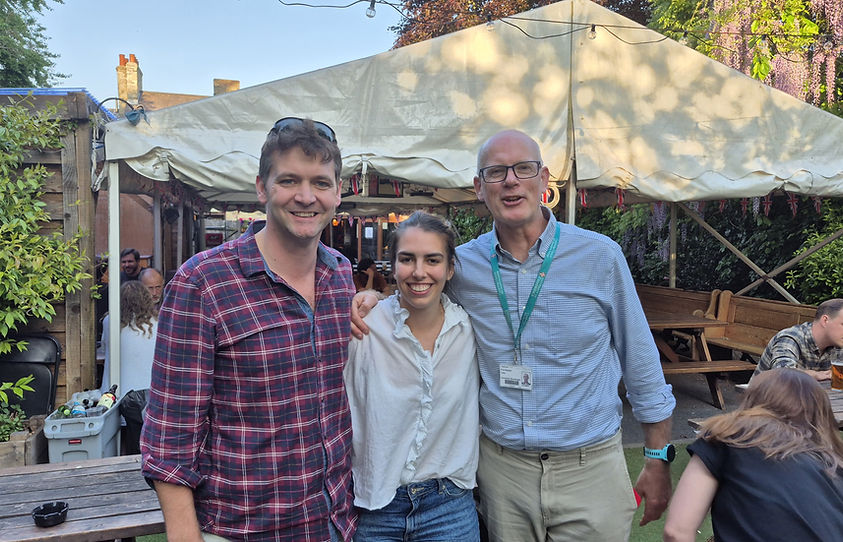 Dr Nicholas Cunniffe, Gioia Riboni-Verri and Professor Alasdair Coles are shown posing for a photo at a party celebrating Gioia's Ph.D. submission