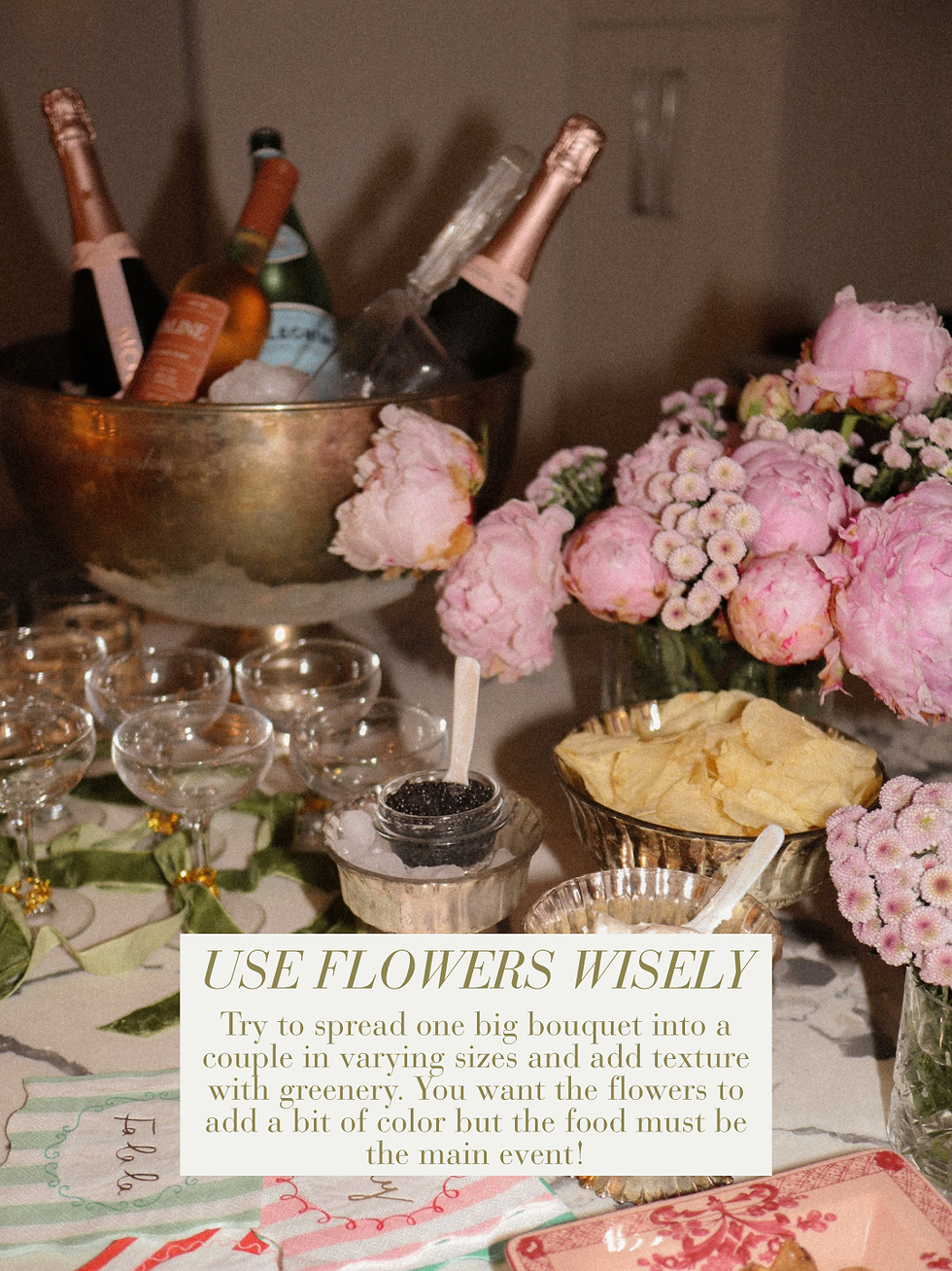 Pink peony bouquets and caviar with potato chips on a maximalist entertaining table with champagne