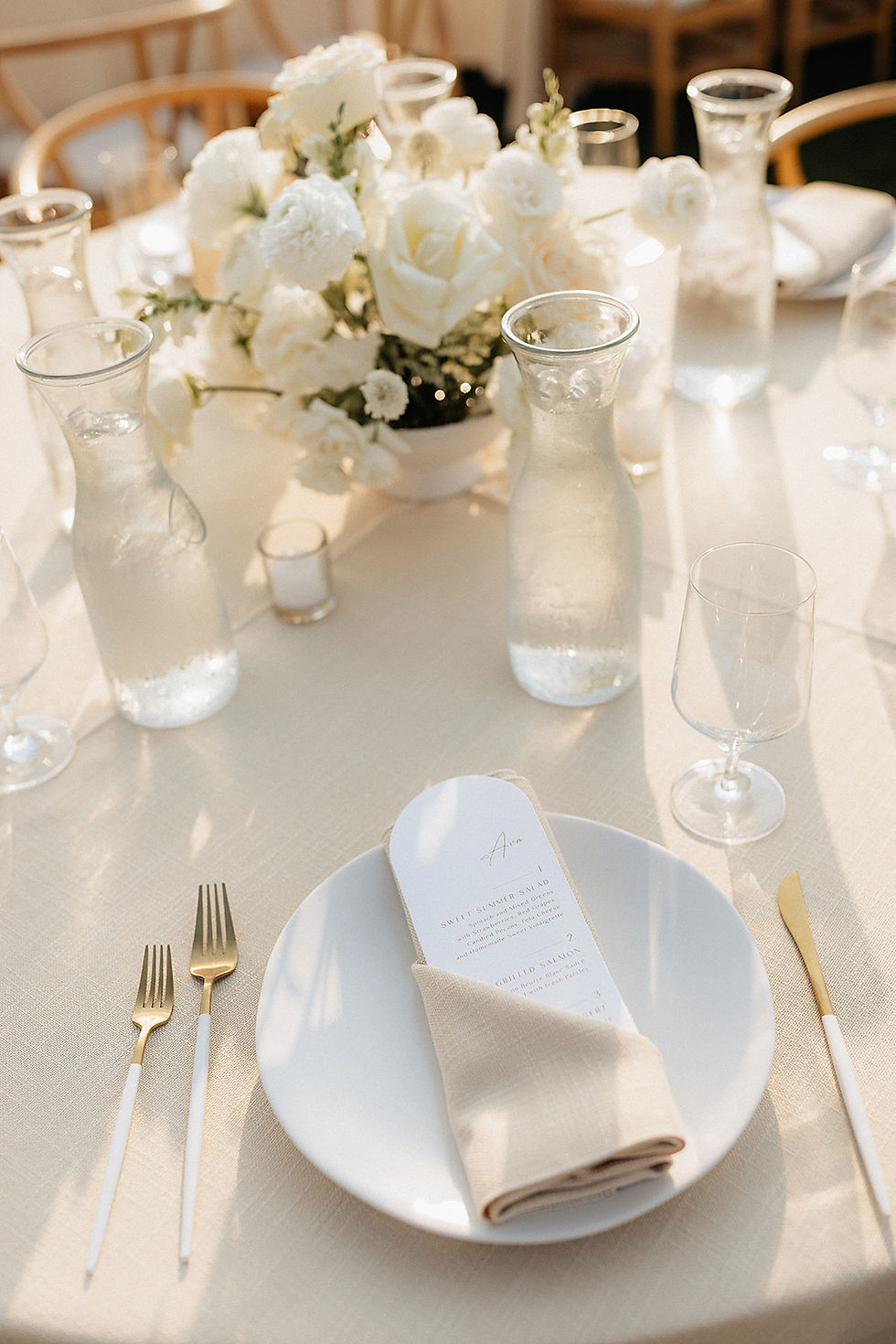 wedding table with plates and dinner glasses