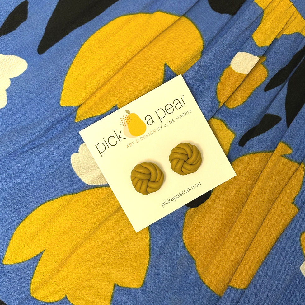 Thumbnail: Molly Knotted Stud Earrings in Mustard