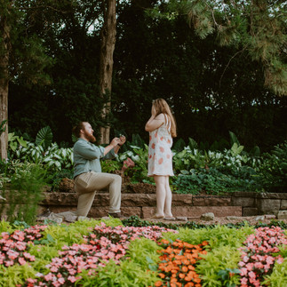 A heartfelt proposal at the romantic Sunken Gardens in Lincoln, NE, capturing the moment she said ye