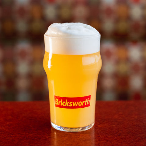 a classic glass of Bricksworth beer in a Bricksworth glass