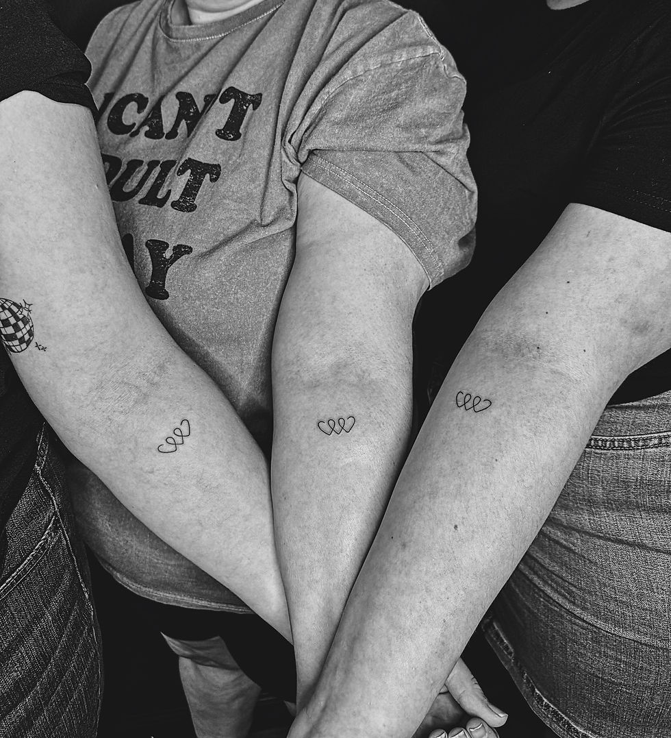 Intertwined Hearts matching tattoo by Moe