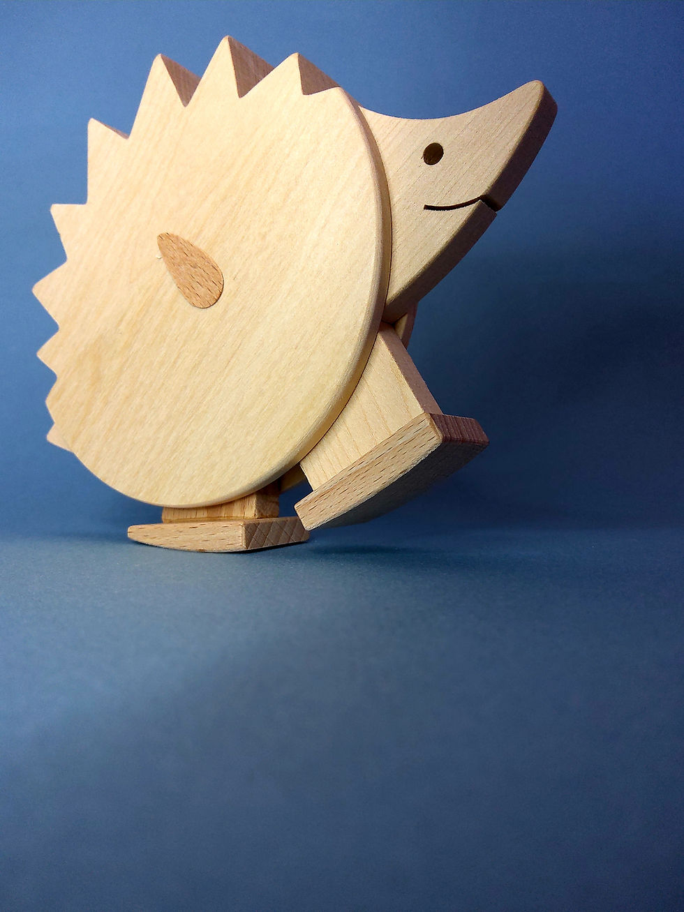 Hedgehog on a ramp. wooden toy