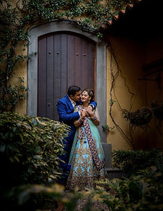 Award-winning Admired in Africa Awards 2016 Bridal Couple photograph by Urvesh Rama Photography, a couple at an arched wooden door
