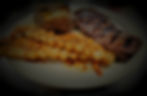 ★ Petite Ribeye w/Shrimp Skewer or Grilled Chicken Breast