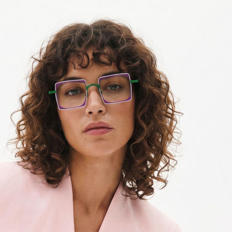 Albert I'mStein designer eyewear worn by a woman, featuring a colorful statement frame that reflects the brand's FUN & HAPPY philosophy and expressive approach to premium eyewear design.