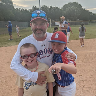 Jeff Hendricks and kids on the baseball field