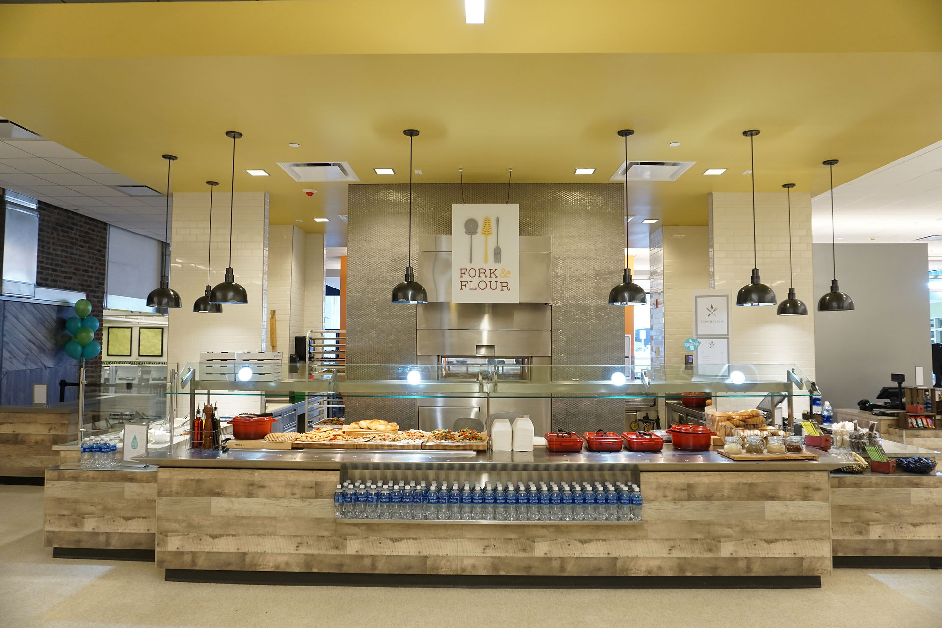 This dual sided hearth serves two stations in this corporate cafe. On one side there are pizzas, eggplant parmigiana, garlic knots and other Italian-style meals. The second station, offers a variety of meat, fish and plant-based entrees.
