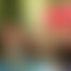 Hands holding cup of steaming herbs with golden aura light around them