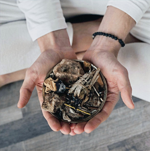 Hands holding a smudging bowl