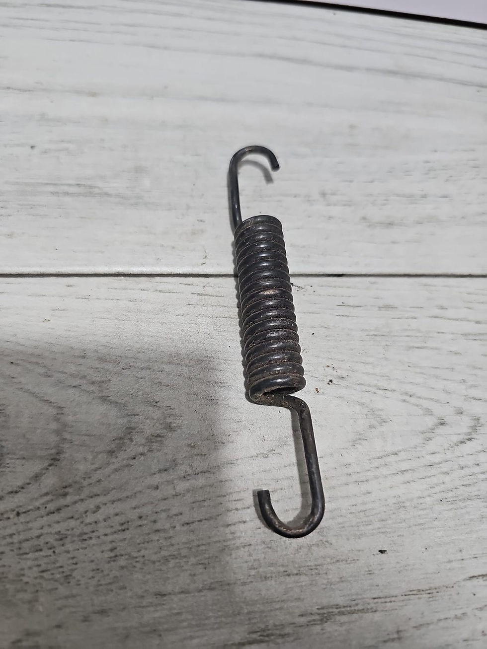 Miniatura: Resorte de freno trasero / Resorte de retorno del freno  🏭 Marca:
