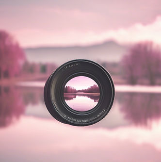 Camera lens reflecting peaceful landscape with slight pink hue _edited.jpg