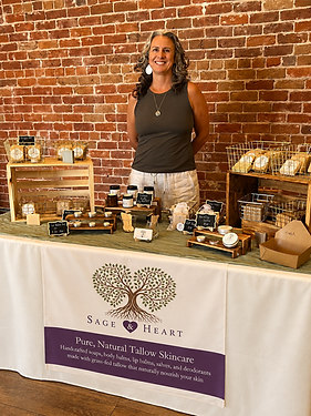 Sara Medina, founder of Sage & Heart, at her handcrafted tallow skincare market booth in A