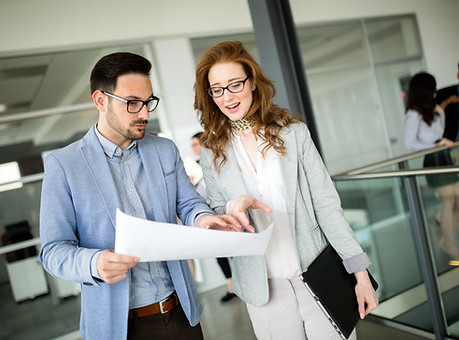business-colleagues-collaborating-and-di