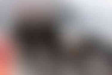 groom entering into the hindu wedding ceremony being welcomed by family