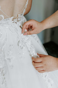 Putting on the wedding dress