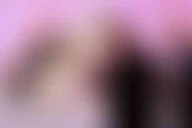 couple laughing at heartfelt speeches at their wedding reception