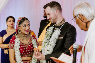 newly married couple happily looking at eachother