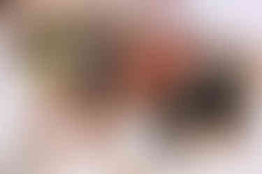 wide angle of the bride and groom with family at their hindu wedding ceremony