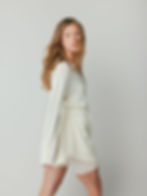 E-commerce photography of a model wearing a white merino wool set