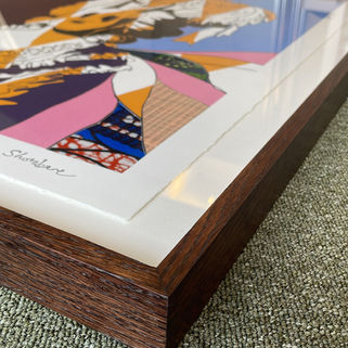 East London · Dark-stained wood frame with float-mounted artwork and
shadow gap — custom framing by Mitre Frames, Hackney Wick