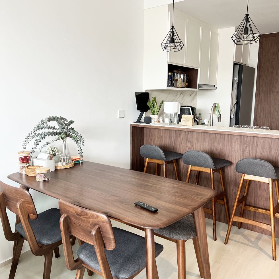 2 Bedroom condominium interior design inspiration with open kitchen, high island, high chairs & dining table