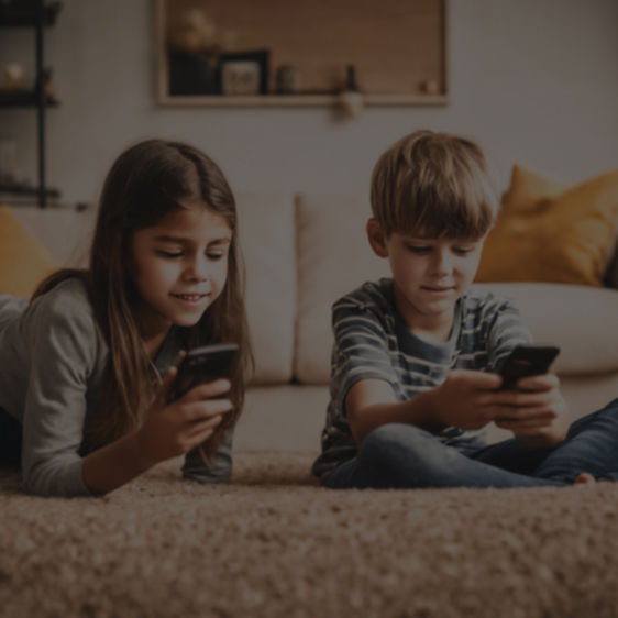 Girl and boy looking at digital devices
