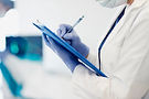 doctor-making-notes-clipboard.jpg