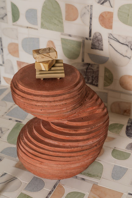 Sculptural terracotta pedestal in Terra Calma cabana bath designed by Firefinish Interiors.