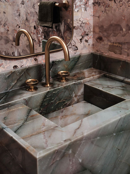 Detail of green marble vessel sink with polished brass faucet, powder bath interior design by Firefinish Interiors Boca Raton FL
