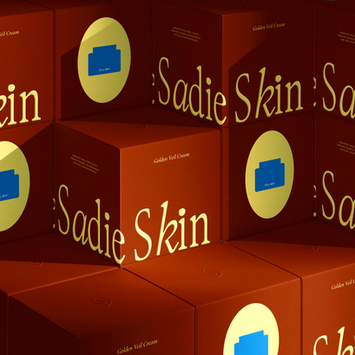 Sadie Skin Golden Veil Cream packaging design in warm red and yellow tones