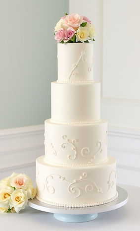 tall wedding cake,, nice deocrations and some gumpaste flower bouqeut on top.jpg